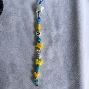 Happy face yellow and blue phone charm